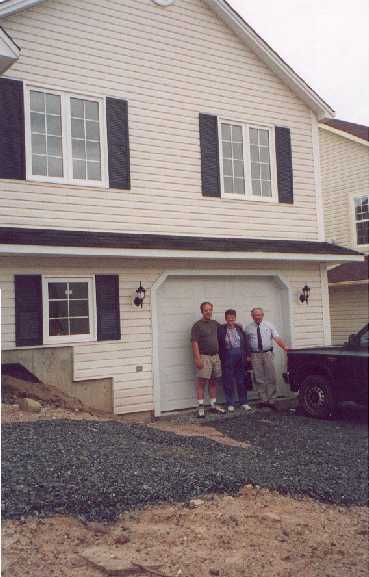Steve and our wonderful Real Estate Agent (aka his dad!) along with his mother by the garage